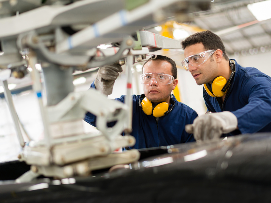 Two men working in an engineering room