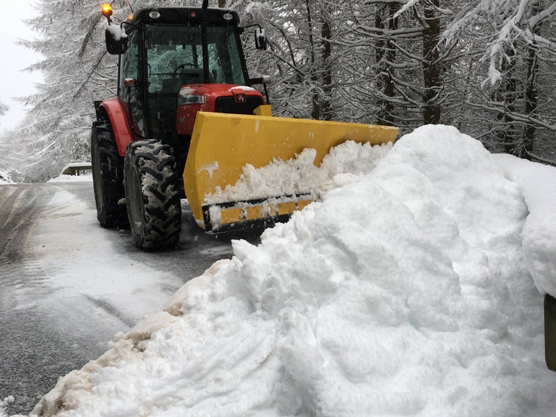 Image of a snow plough pushing snow.
