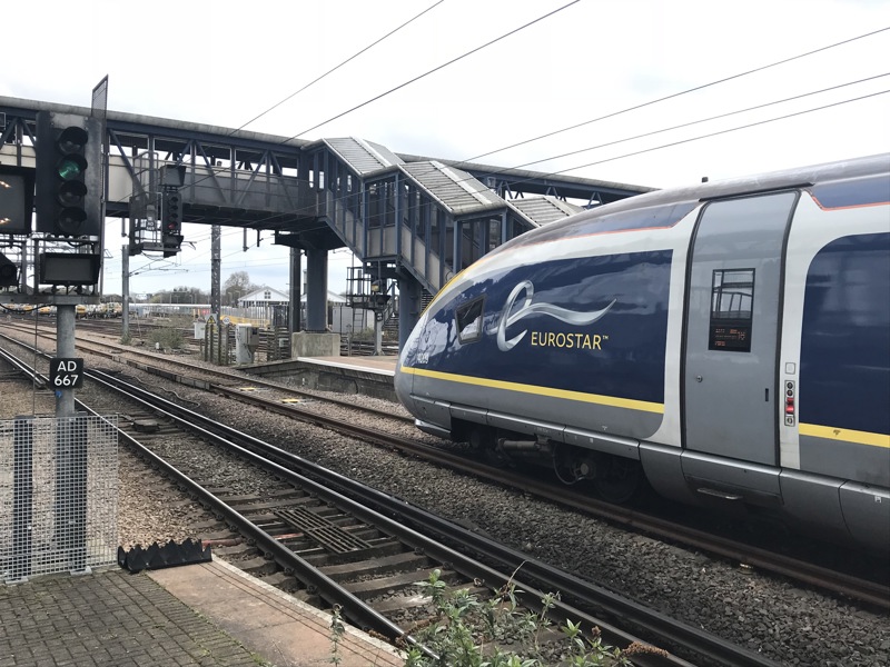 Image of the Eurostar going under a walkway.