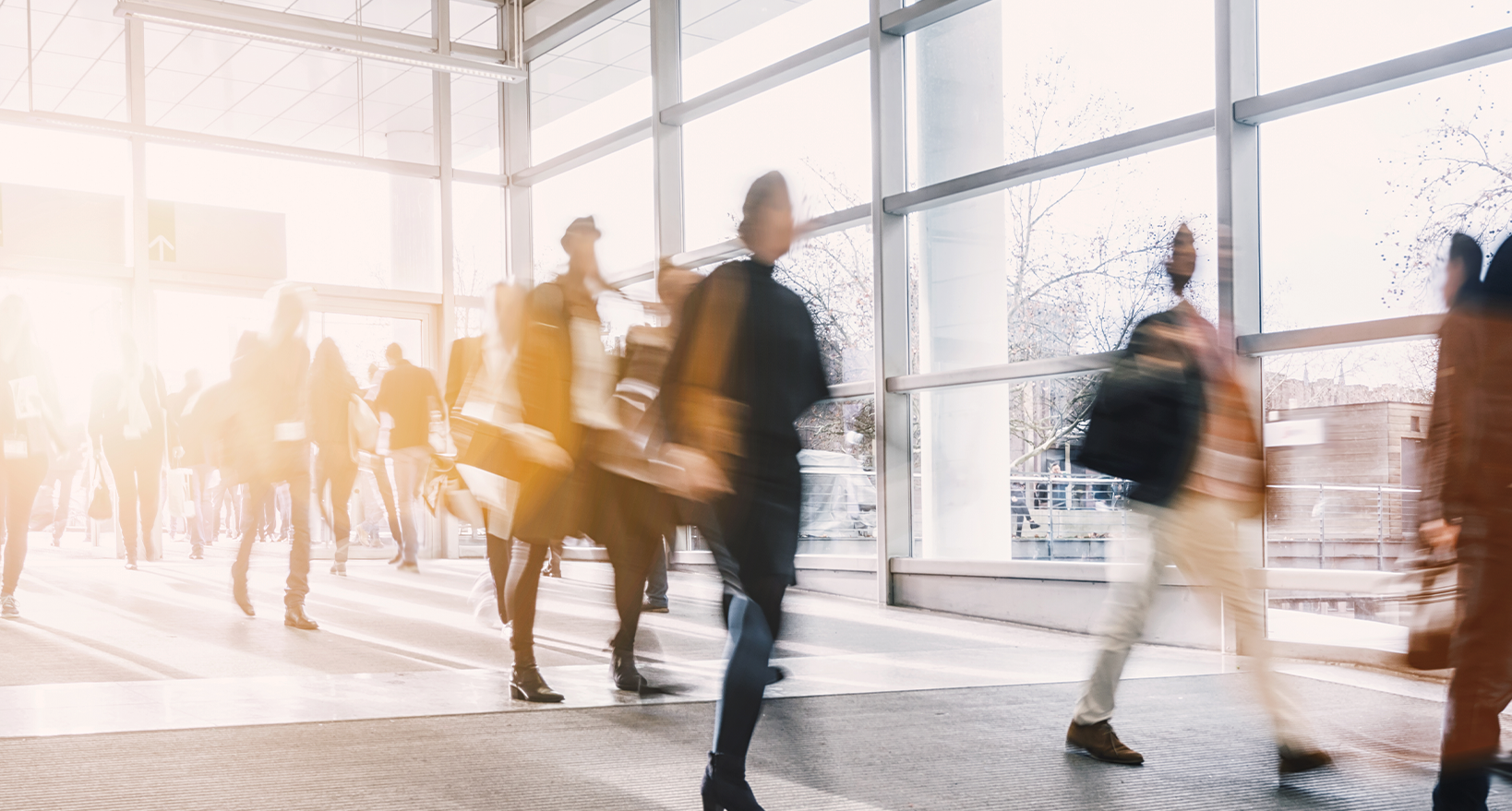 A picture of people walking in an office building