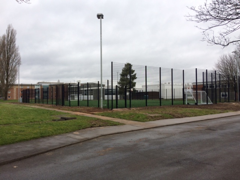Image of a fenced off football pitch.