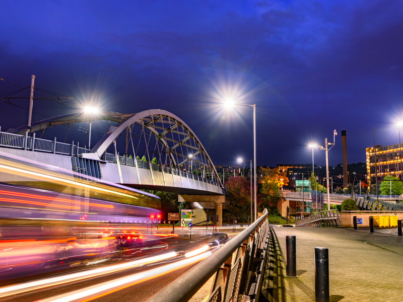 Image of a bridge, with traffic moving at speed.