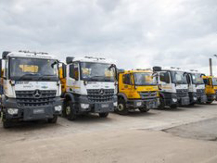 Line up of gritters at a depot