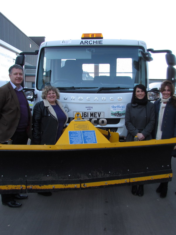 a group of people stood in front or 'Archie' the gritter.