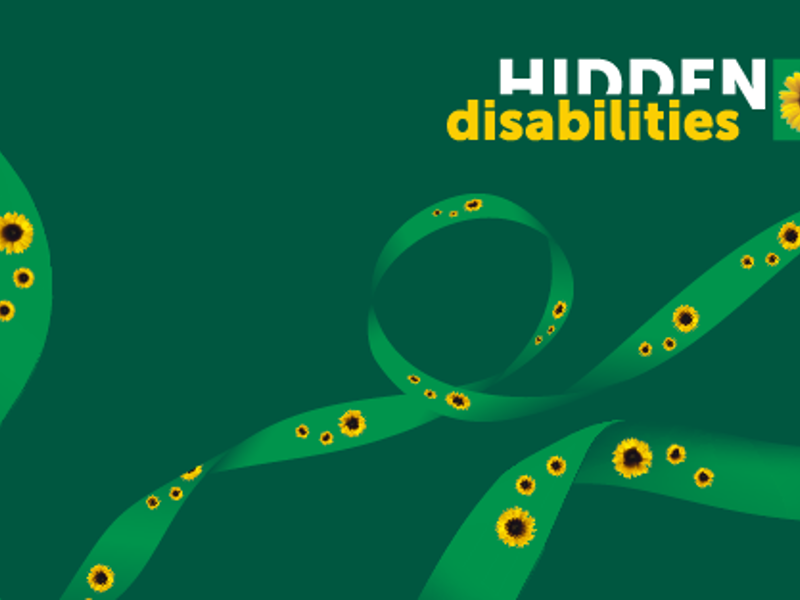 A image of hidden disabilities sunflowers on a ribbon, with a globe on a green background.
