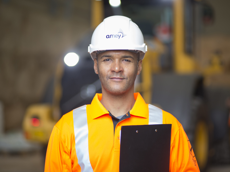 Amey employee, holding a clipboard.