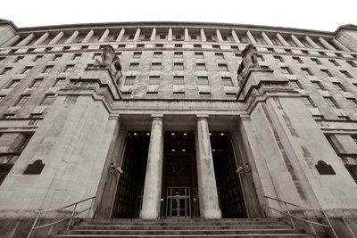 Image of a building with an pillar entrance way.