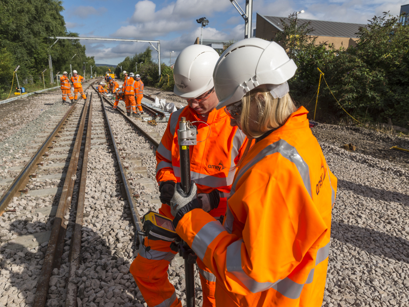 Amey employees carrying out work on a rail track.