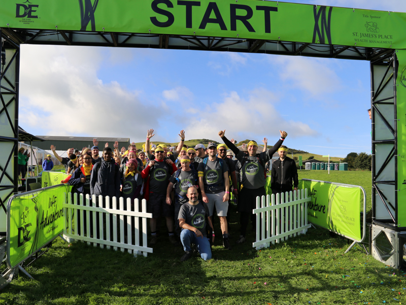 Image of a group of runners at the start line of a charity race.