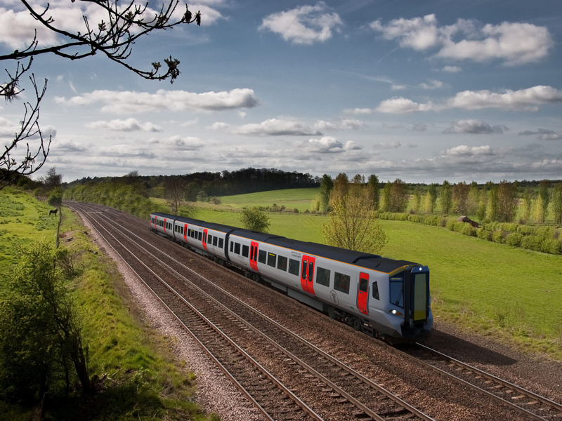 Image of a train going through the country side.