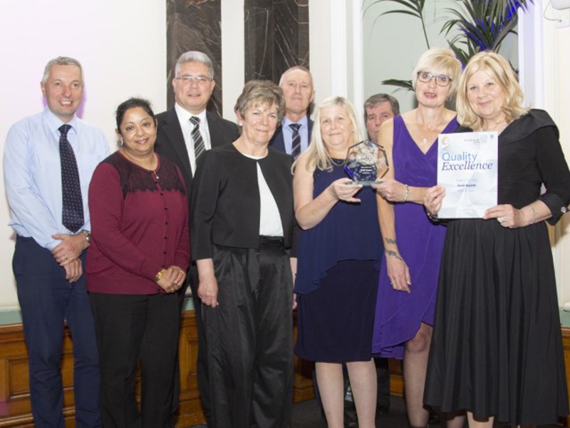 Image of Amey employees receiving a Quality Excellence award.