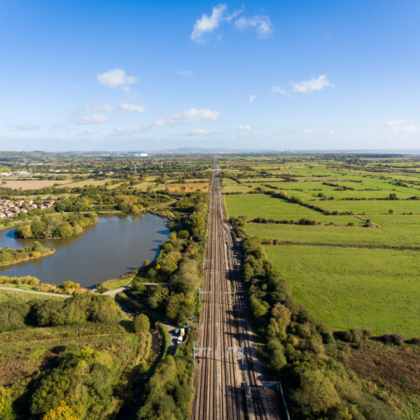 image of a rail track in the countryside taken from a height
