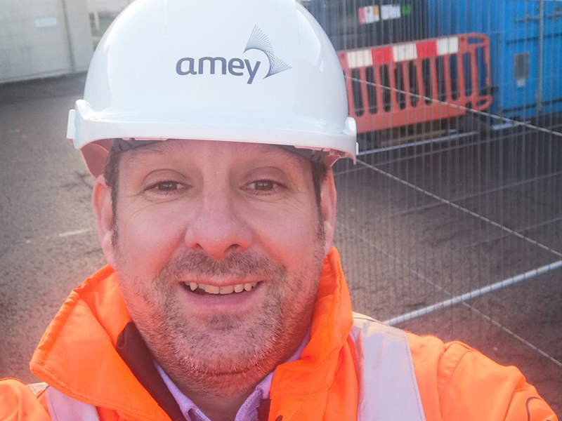 Selfie image of an Amey employee in PPE.
