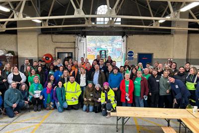 a group shot of people in a warehouse.