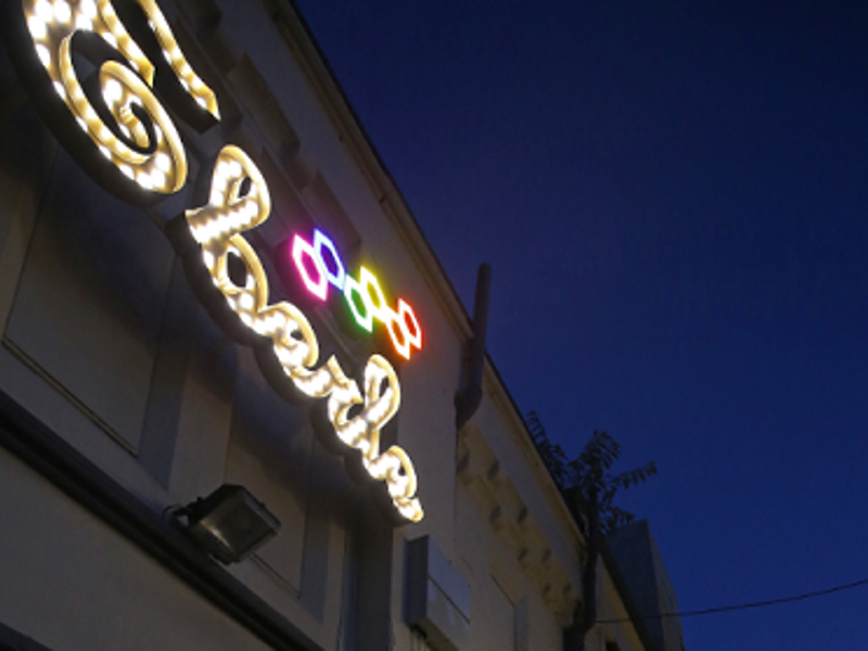 Image of Eberle lit up shop sign.