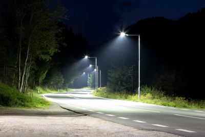 a road lit up with street lighting