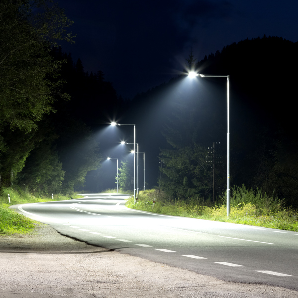 a road lit up with street lighting