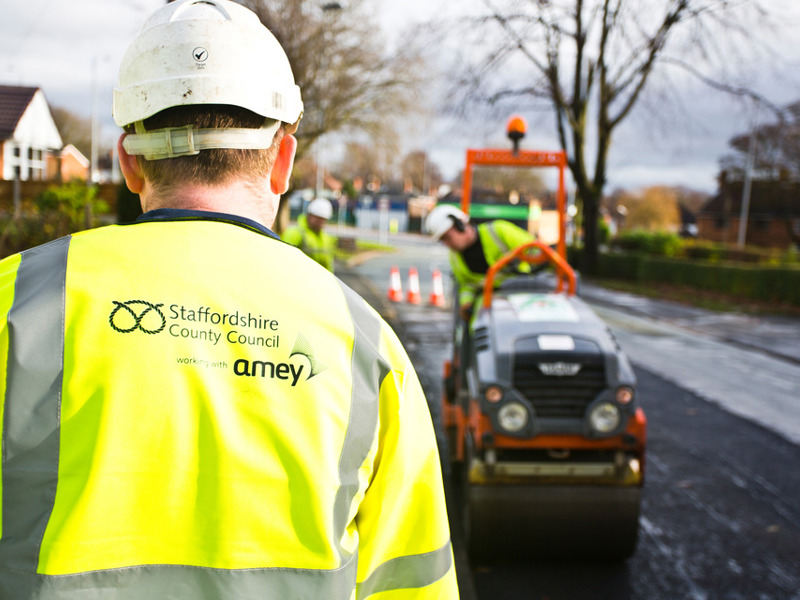 Image of Amey staff tarmacking a road.