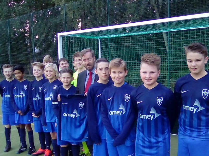 Image of a the football team Hawley Raiders, holding the Amey sponsored kit.