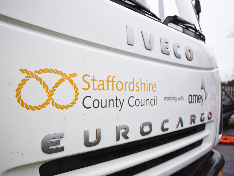 Image of a front bumper of a 'Staffordshire County Council working with Amey' vehicle.
