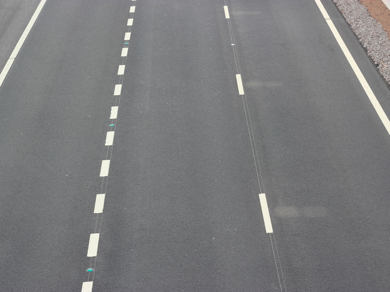 Image of white lines on the road.