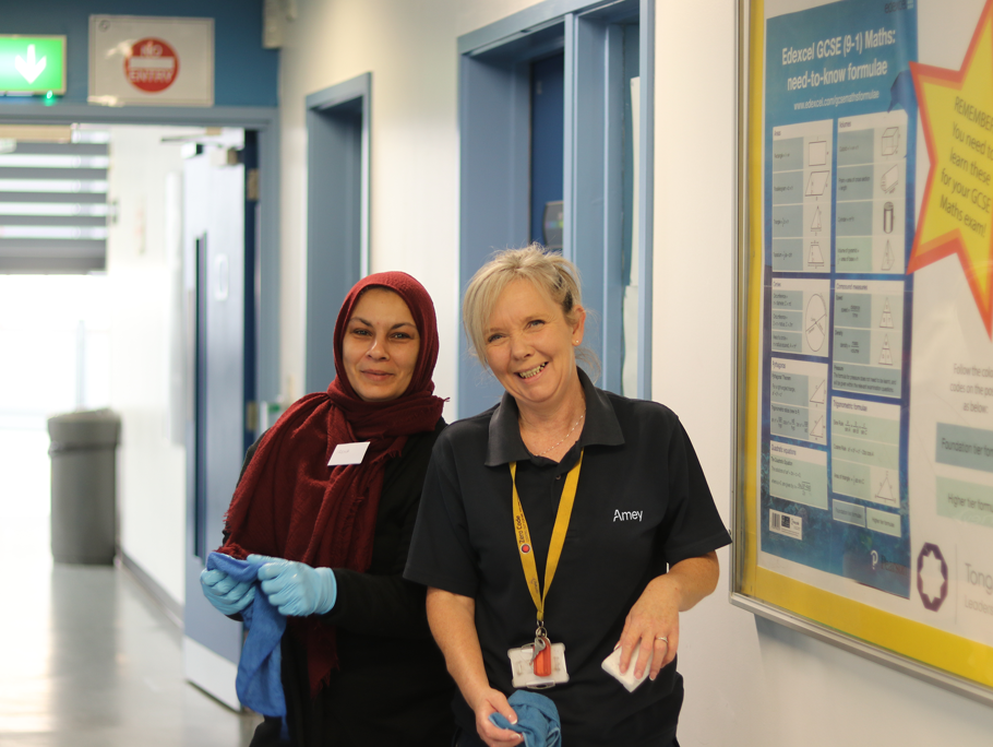 Image of two ladies cleaning 