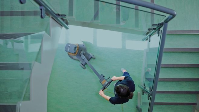 Ariel view of a cleaner, cleaning the floor