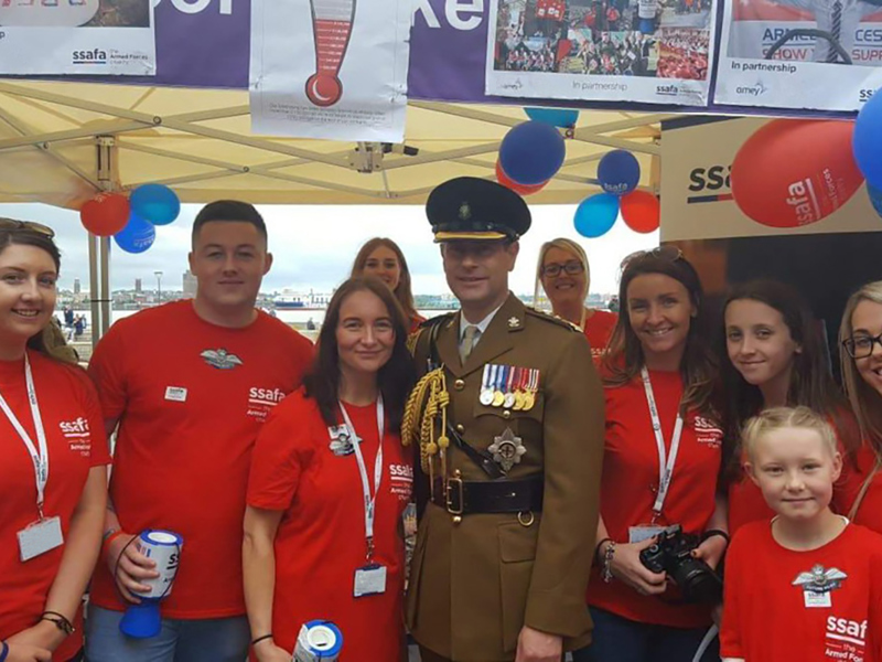 Amey employees and military personnel at a SSAFA charity event.