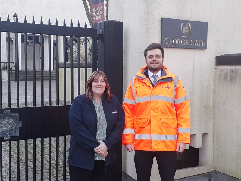 Two Amey employees in front of George gate.