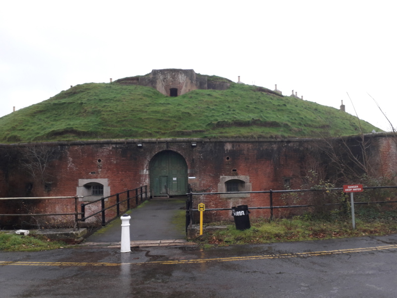 Image of a mound surrounded by a wall.