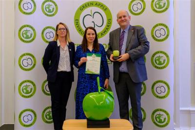 three Amey employees holding the International Green Apple Environment Award