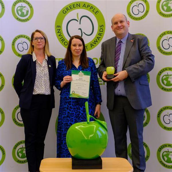 three Amey employees holding the International Green Apple Environment Award