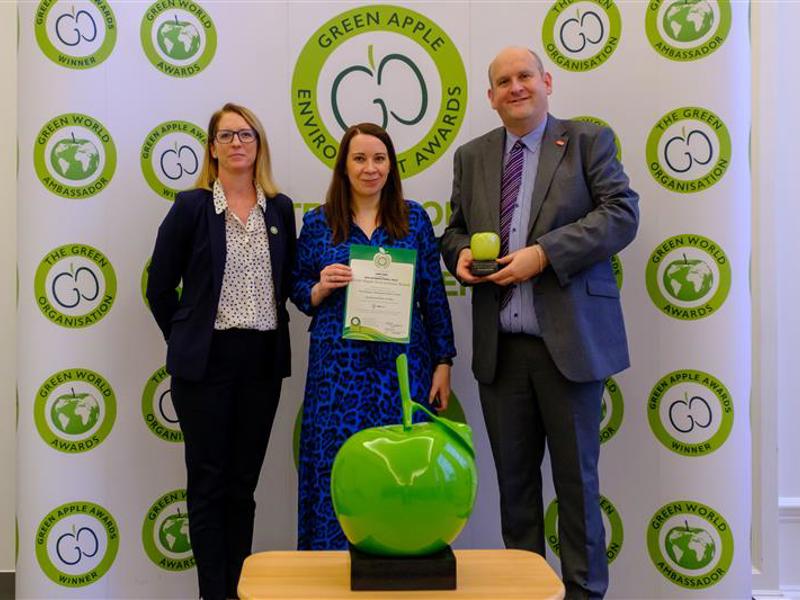 three Amey employees holding the International Green Apple Environment Award