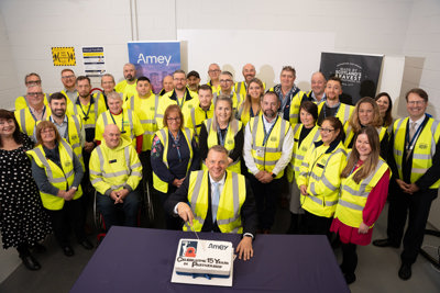 Image of Amey employees celebrating 15 years of partnership with RBLI.