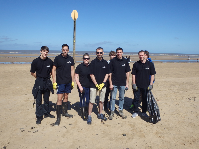 Image of Amey employees litter picking at Formby beach.