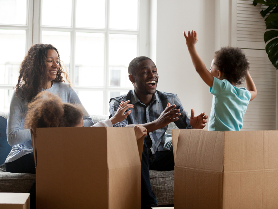 Image of family moving into new home