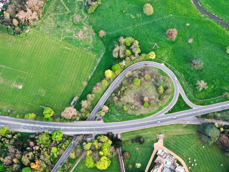 Ariel view of a road surrounded by trees