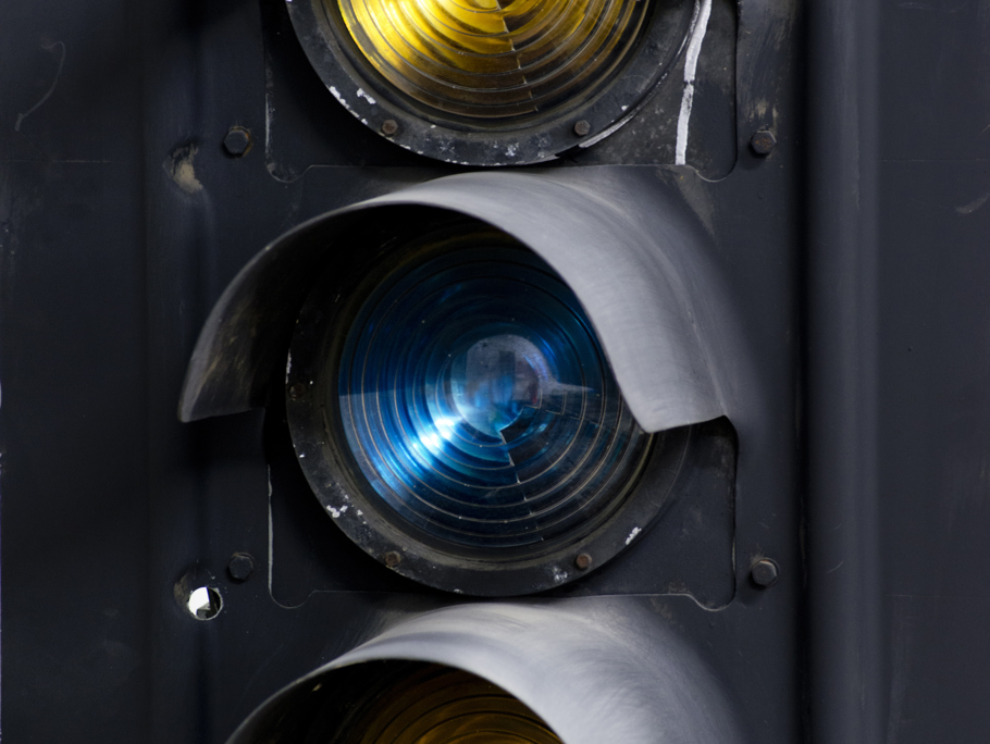 Up close yellow and blue train traffic control lights